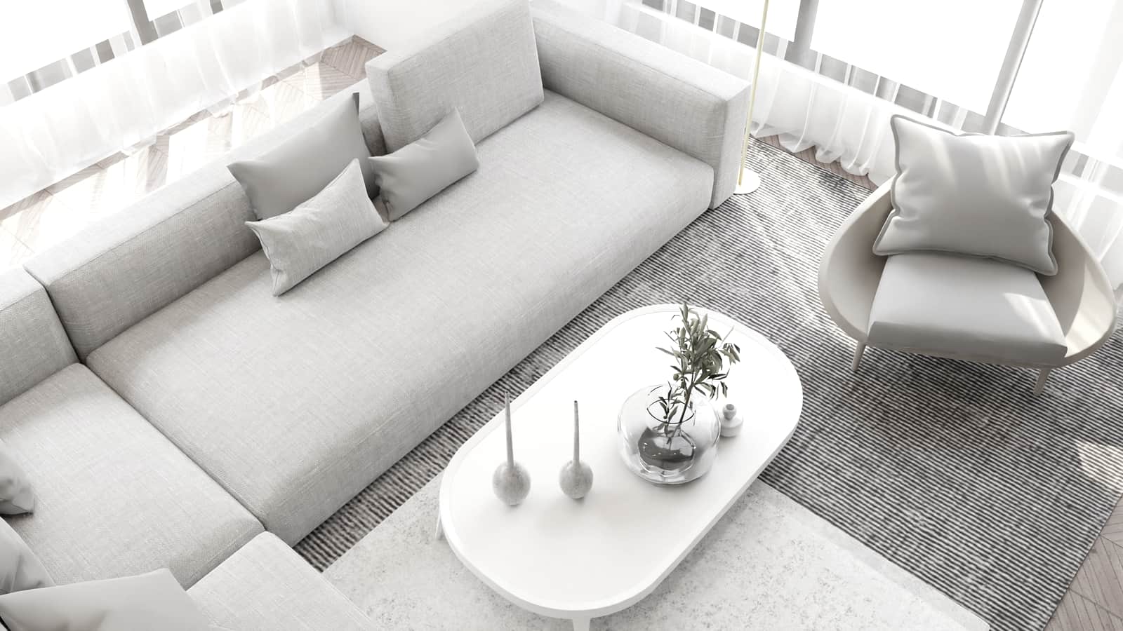 A pale, sunlit living room with a low sofa